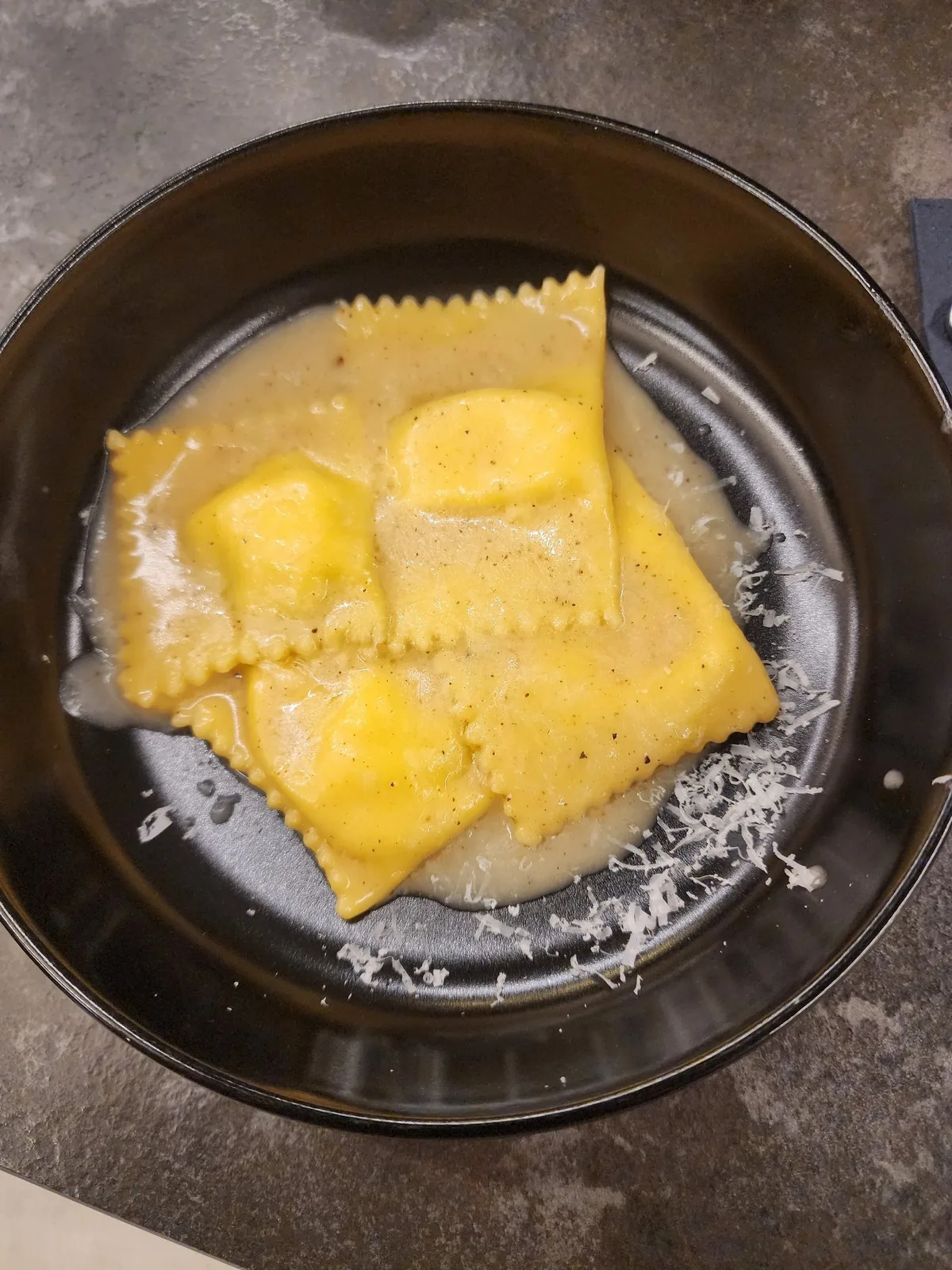 Handmade ravioli finished in a cream sauce